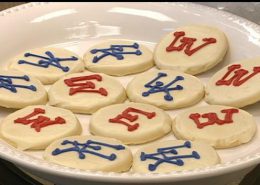 Photo of cookies with opposing sports team logos on them
